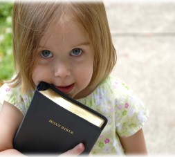 This little one picked up her dad's Bible on the way out of church.